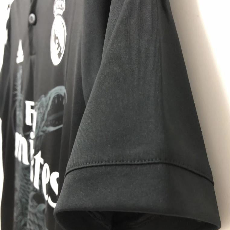 Real Madrid sleeve detail on black dragon jersey
