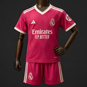 Real Madrid Third Jersey 2026 Kids Set front view with pink jersey and matching shorts