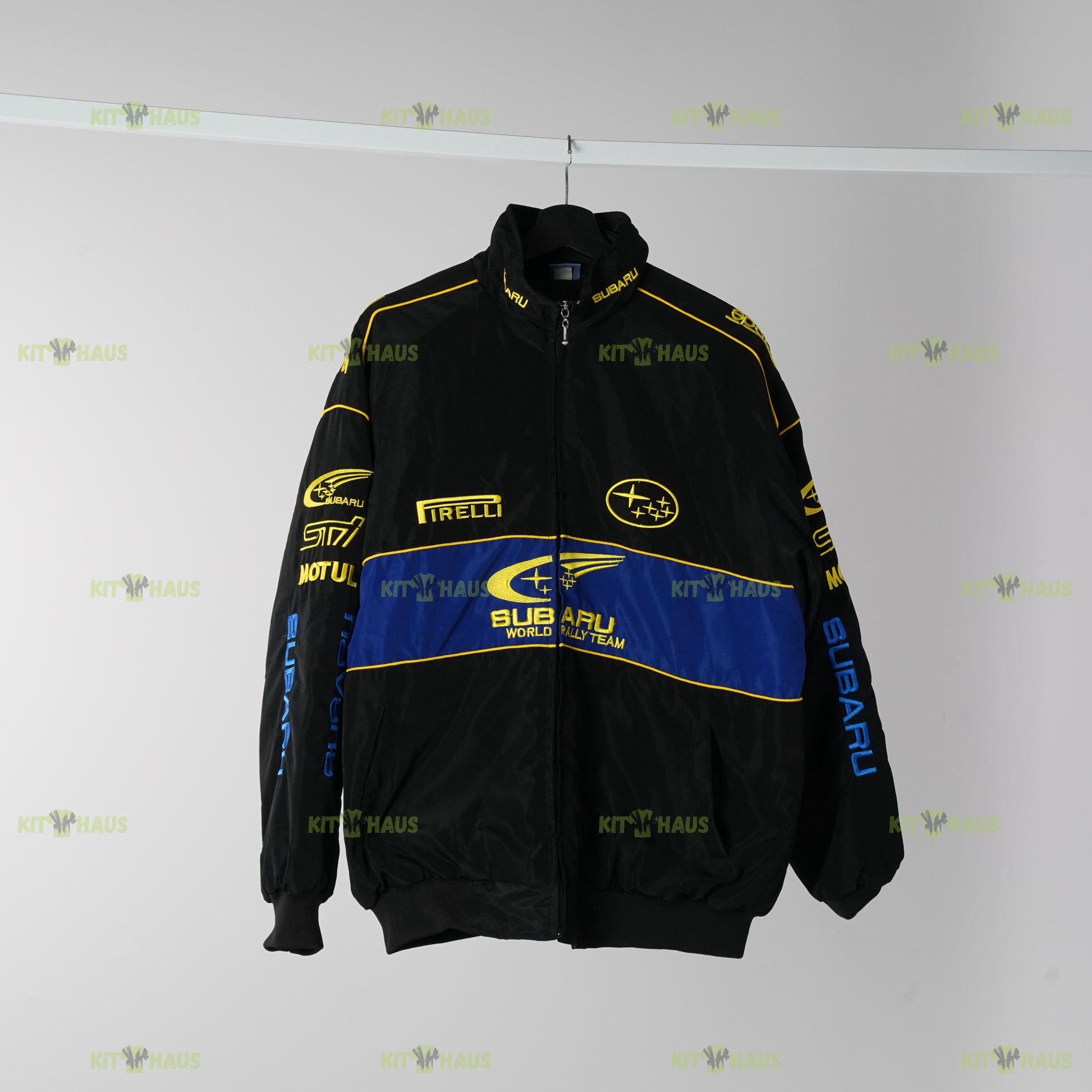 Subaru World Rally Team jacket front view with blue stripe and rally logos