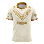 Tonga Rugby League World Cup 2026 Away Jersey front view, cream with gold ngatu patterning, gold collar and Kingdom of Tonga crest