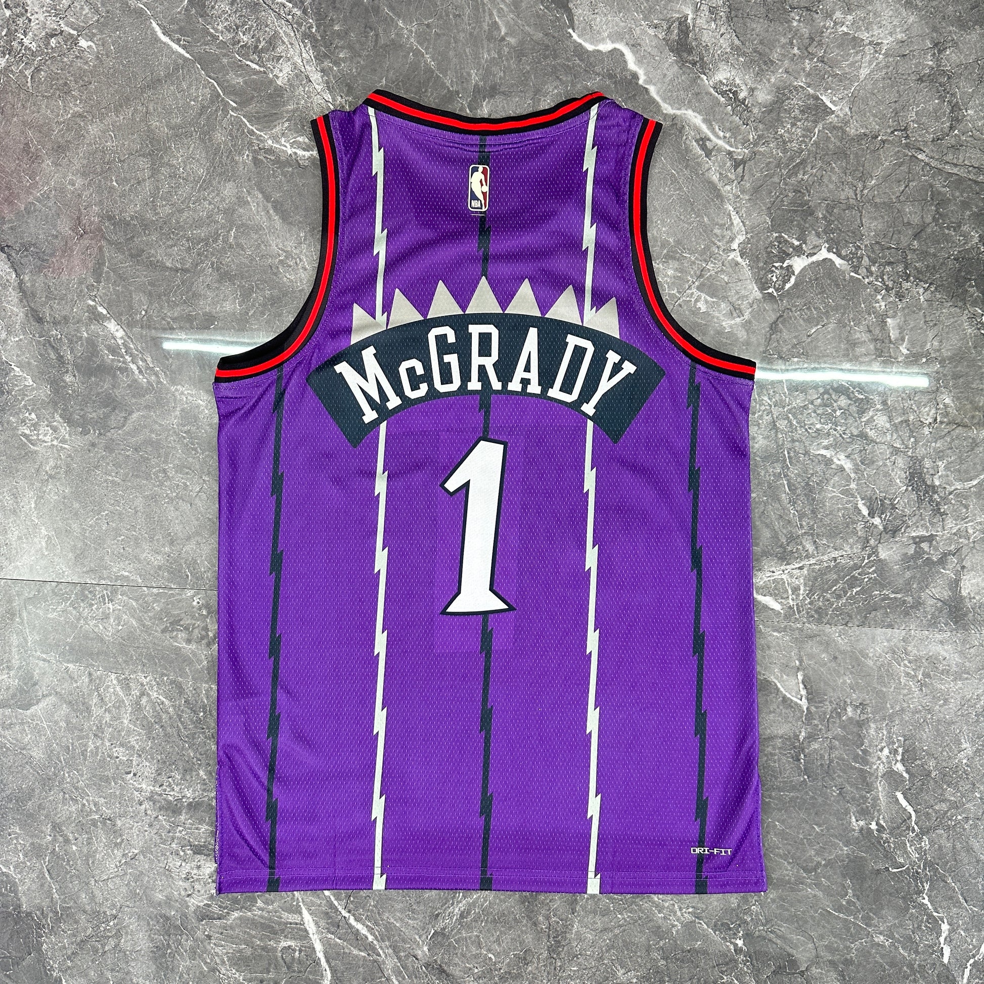 Toronto Raptors 2025/26 retro purple swingman jersey Tracy McGrady number 1 front and back view
