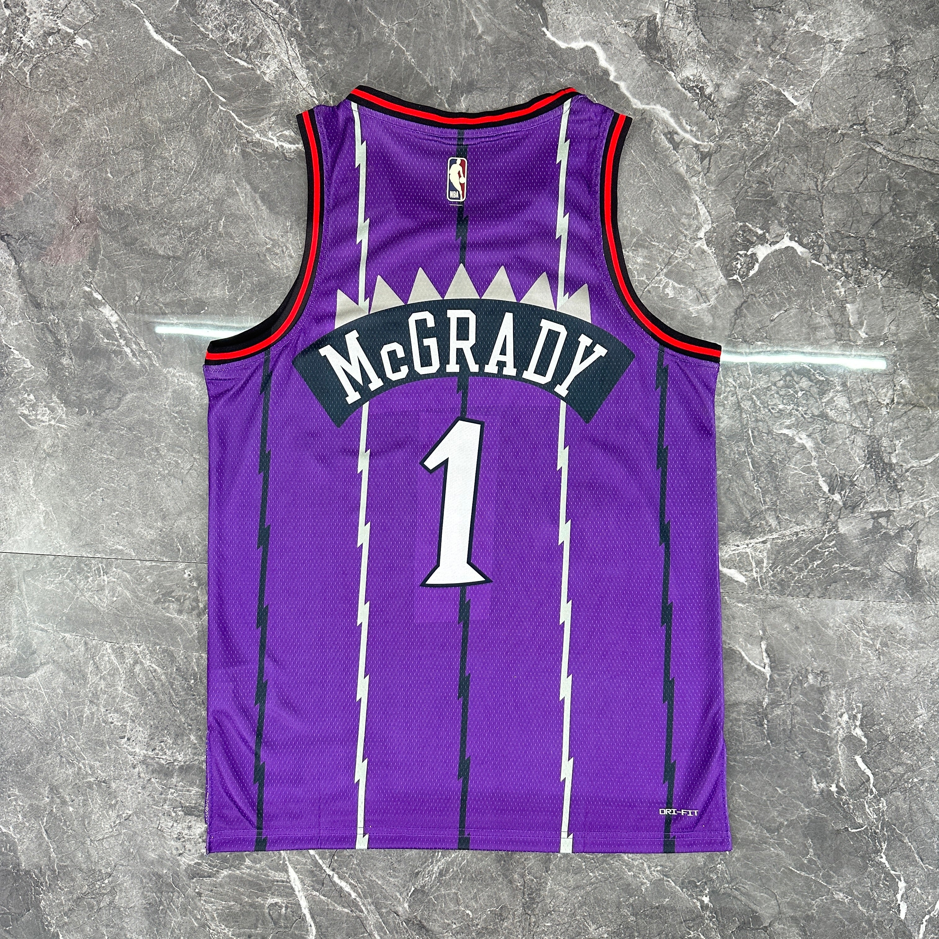 Toronto Raptors 2025/26 retro purple swingman jersey Tracy McGrady number 1 front and back view