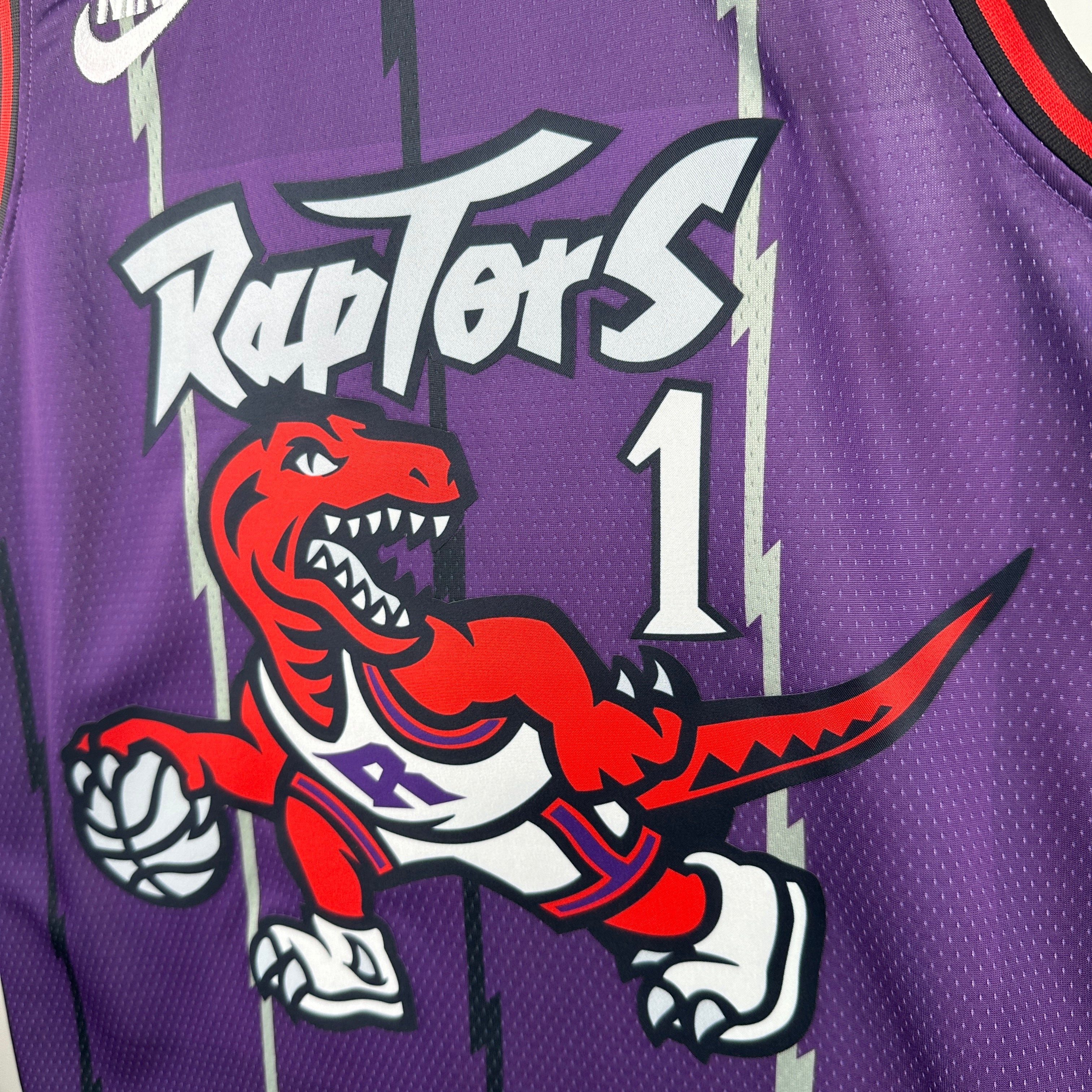 Toronto Raptors 2025/26 retro purple swingman jersey Tracy McGrady number 1 front and back view