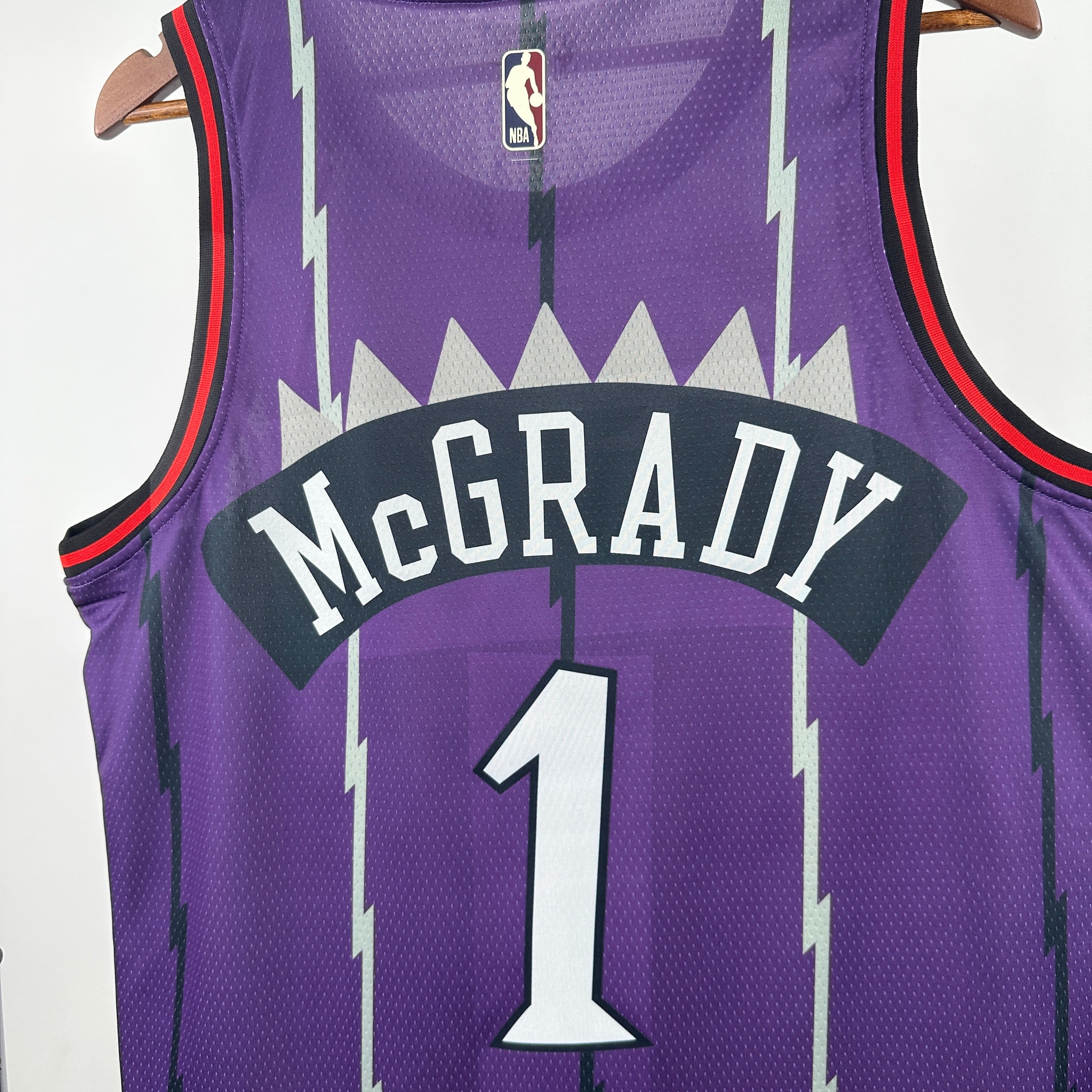 Toronto Raptors 2025/26 retro purple swingman jersey Tracy McGrady number 1 front and back view