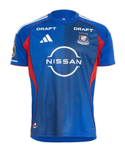 Yokohama F. Marinos Home Jersey 2026/27 front view in blue with tonal striping, red side panels, club crest and Nissan sponsor
